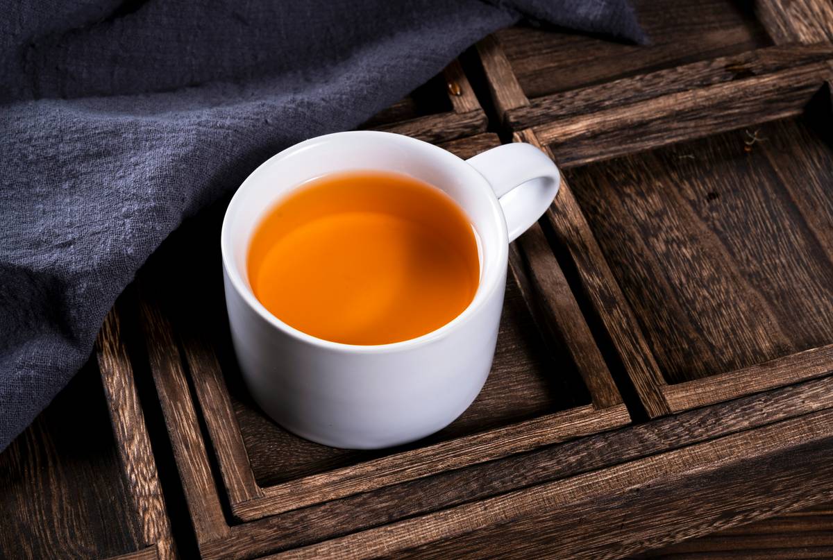 comparison of golden milk for colds ingredients showing turmeric root, coconut milk, and black peppercorns