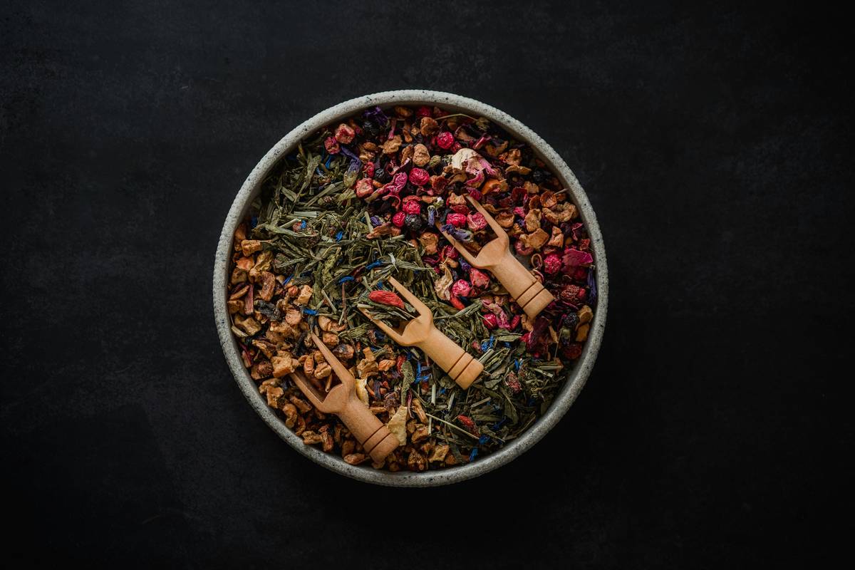 herbal wellness turmeric in golden powder form beside black pepper and coconut oil for enhanced absorption